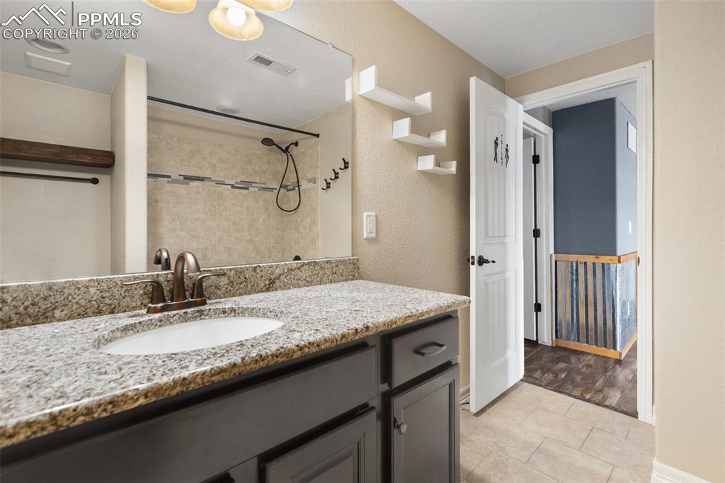Image 32 of 45: A functional and full bathroom in the basement