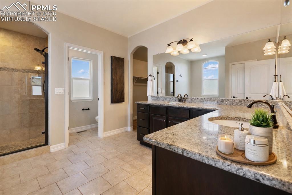 Image 5 of 45: Well-designed primary bathroom with a modern feel (Virtually Staged)