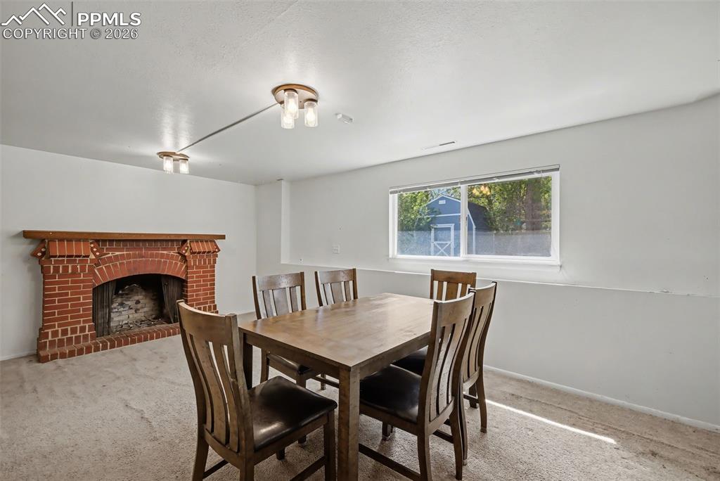 Image 17 of 37: Large family room currently used as dining area