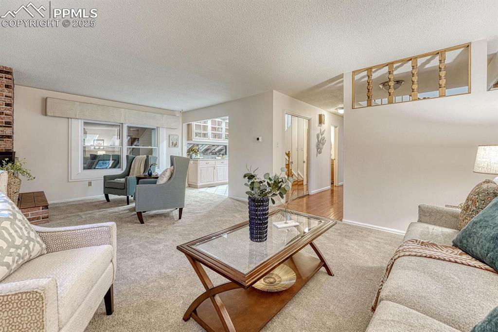 Image 12 of 50: The Living Room has convenient access to the updated Kitchen.