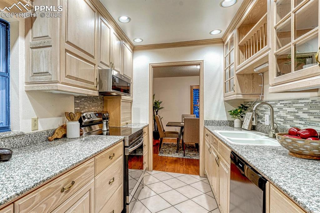 Image 18 of 50: The Kitchen is conveniently located off the Dining Room for easy food servi