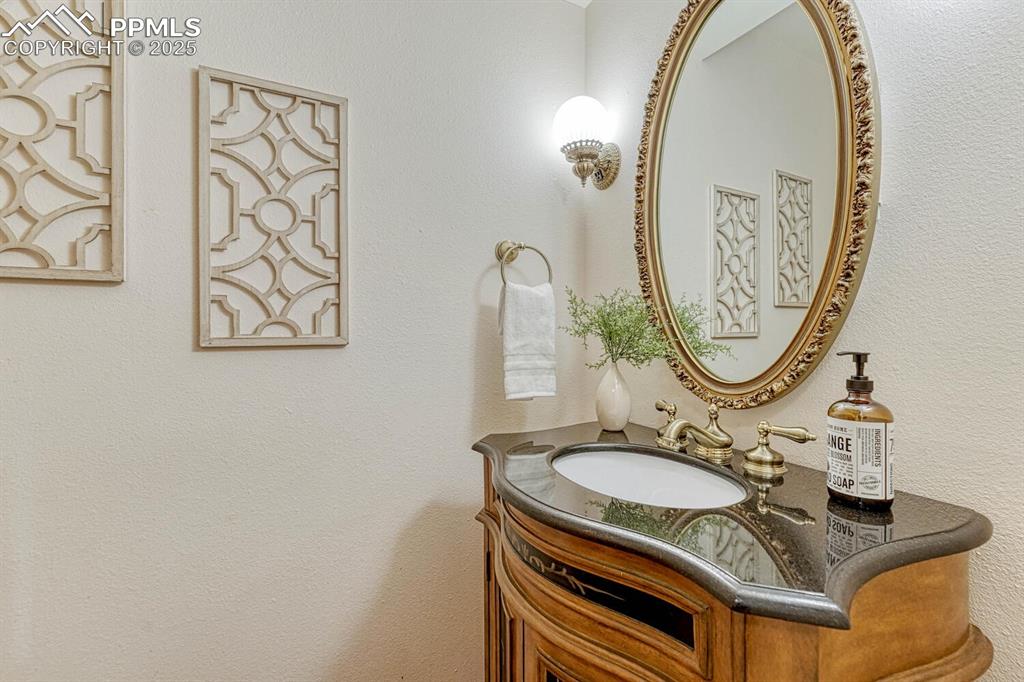 Image 25 of 50: Convenient Powder Bathroom for guests.