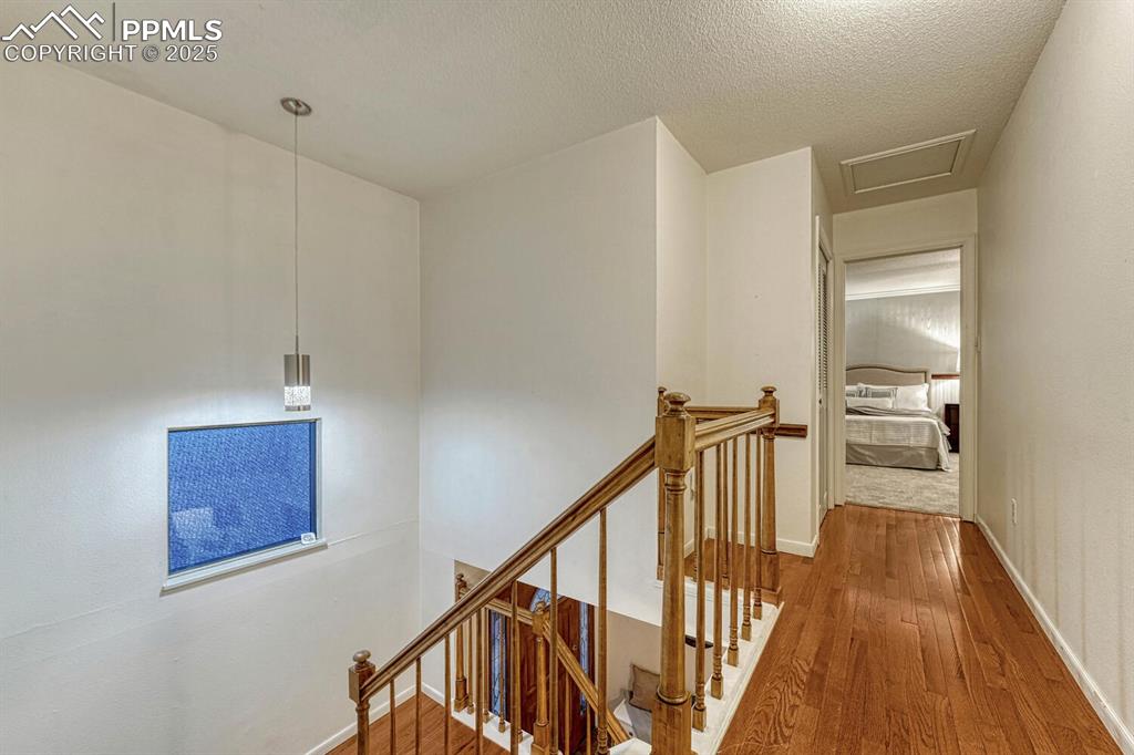 Image 26 of 50: Stairs to the Upper Level Hallway.