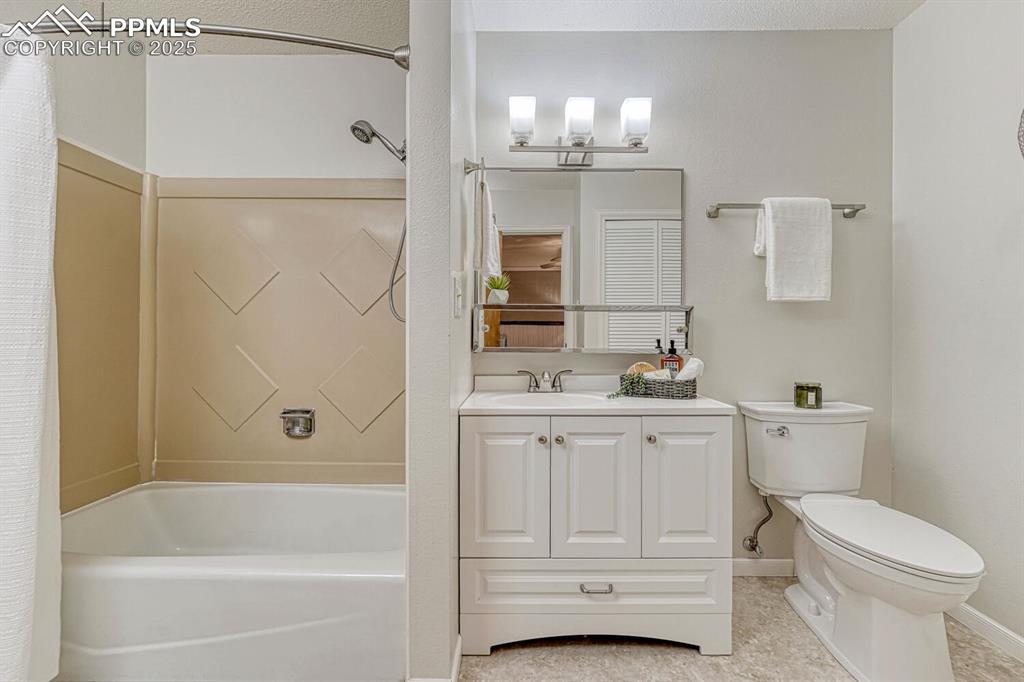 Image 35 of 50: The updated Primary Bathroom offers a vanity, mirror, and tub/shower.