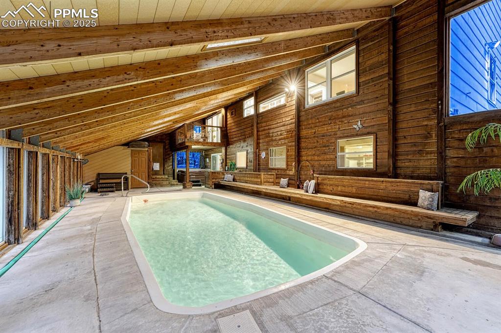 Image 43 of 50: Enjoying swimming in the heated pool year round in this indoor pool and hot
