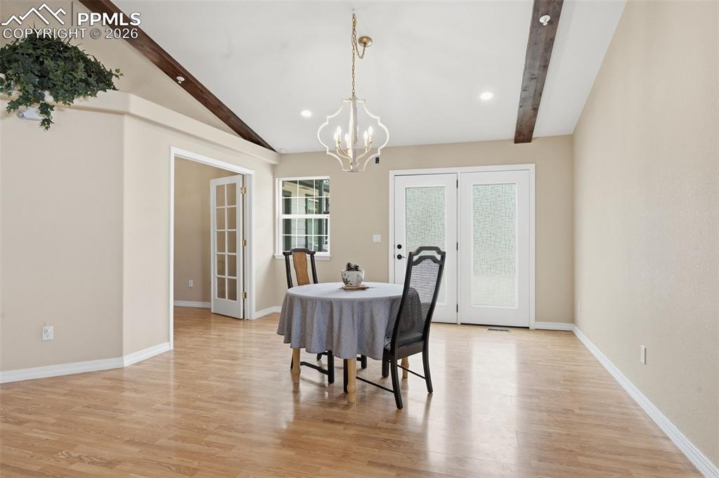 Image 14 of 50: Breakfast area with a walkout to the back patio