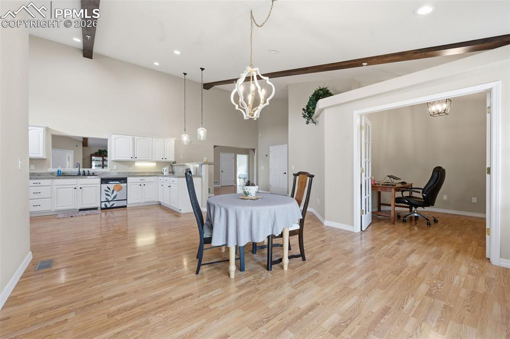 Image 15 of 50: Breakfast area with the office in the background