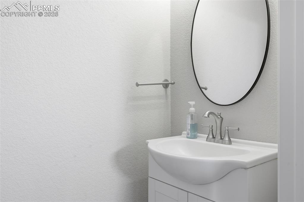 Image 18 of 50: Guest half bath off the kitchen