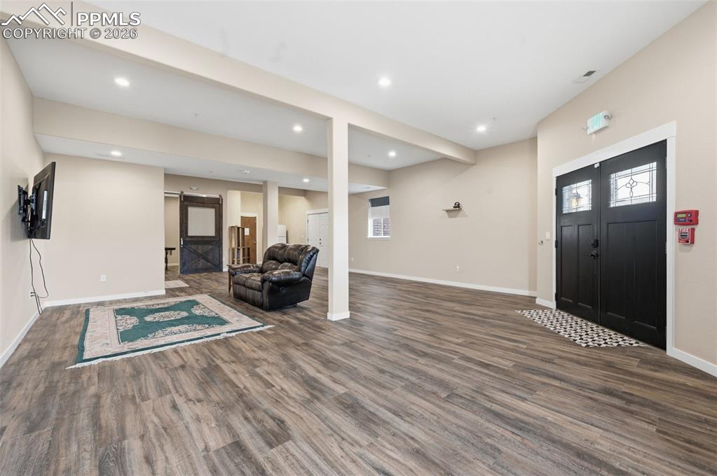 Image 28 of 50: Entry into the family room on the lower level