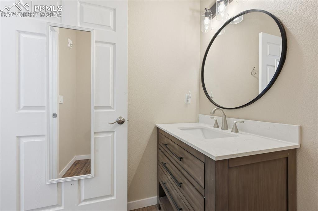 Image 44 of 50: Half bath off bedroom #8