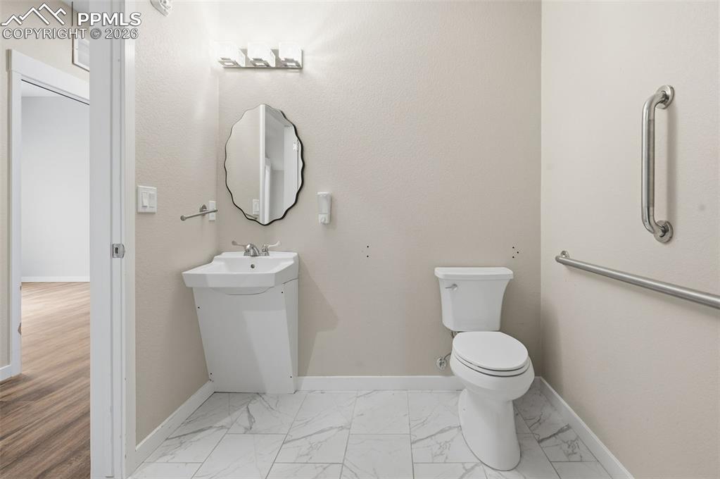 Image 46 of 50: Lower level 3/4 hall bath