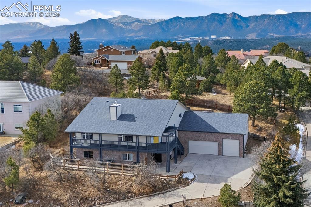 Image 49 of 50: Air Academy in the background. Notice the extra garage door opener for a mo