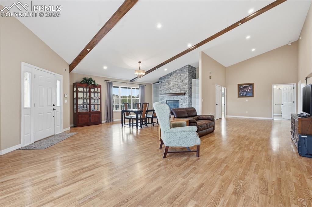 Image 5 of 50: Great Room with beamed ceiling