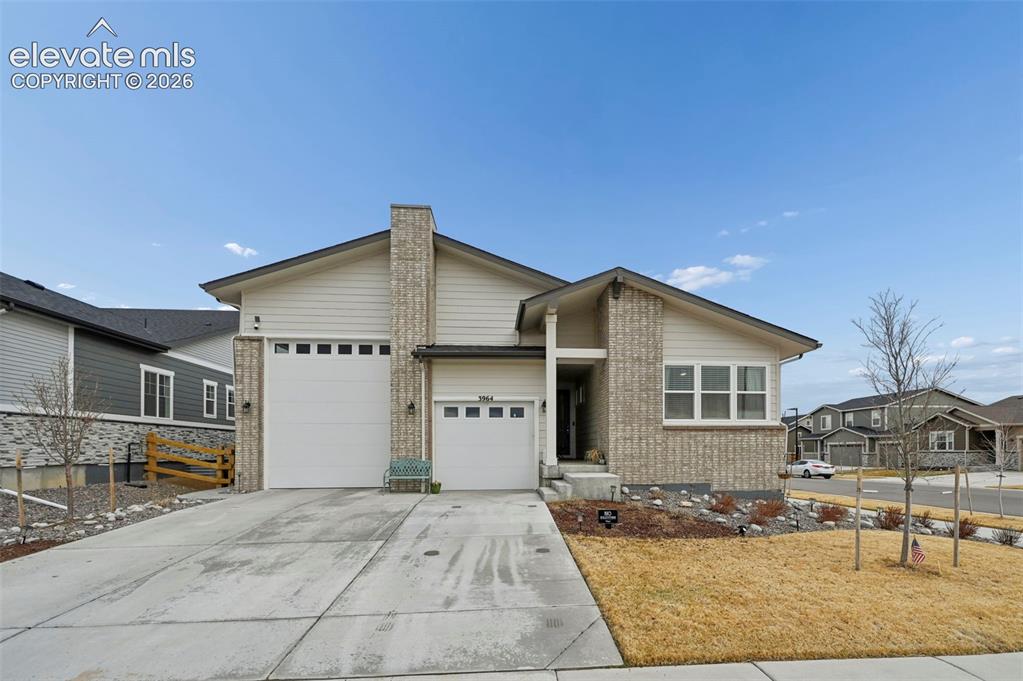 Image 1 of 31: Contemporary exterior with stone facade accents and horizontal siding