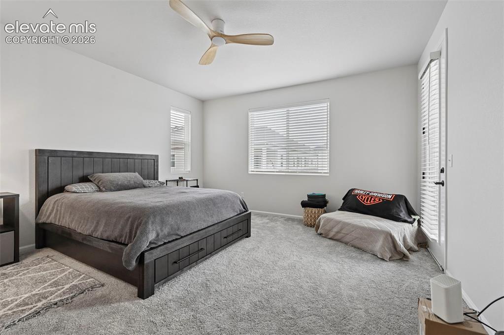 Image 15 of 31: Neutral wall tones, recessed lighting, and a contemporary ceiling fan