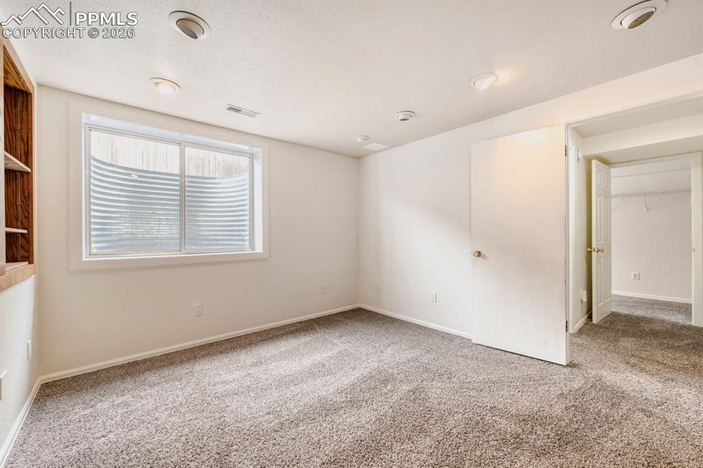 Image 25 of 26: Basement bedroom