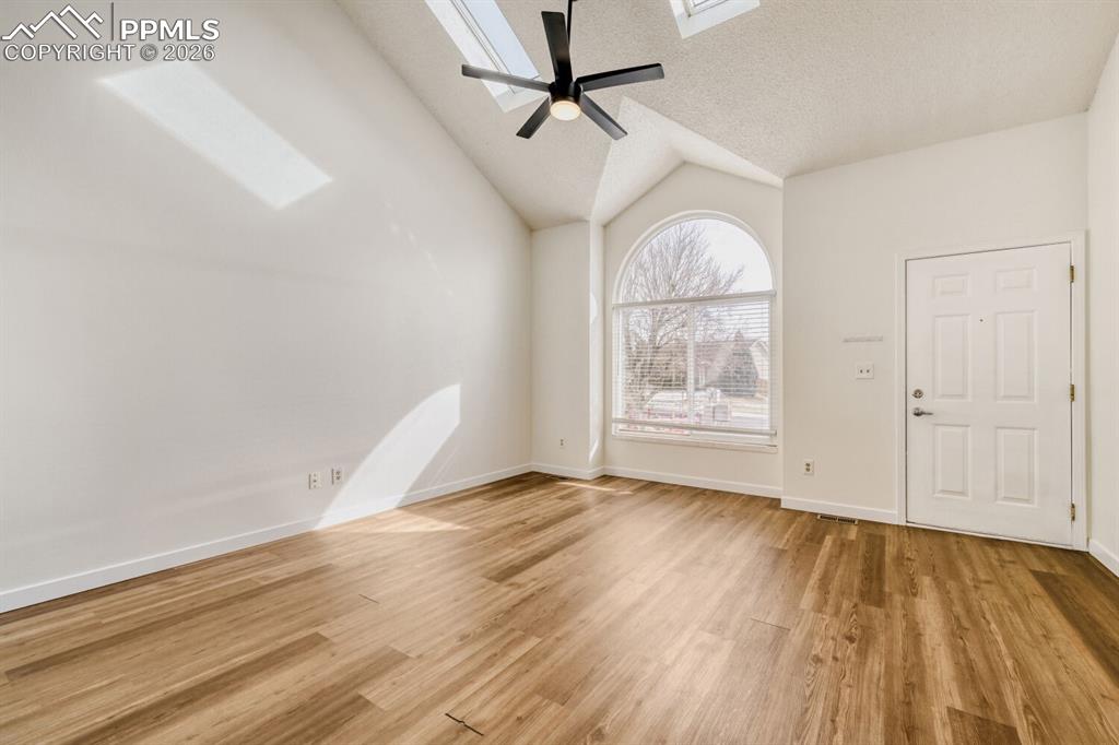 Image 5 of 26: Vaulted ceilings with skylights, fresh paint, tons of natural light