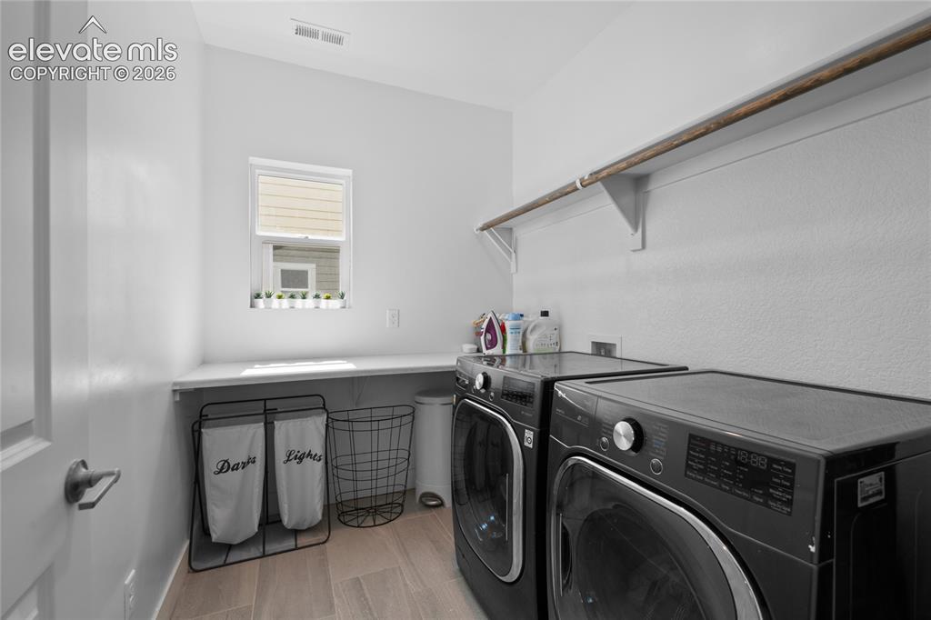 Image 32 of 45: Convenient upper level Laundry