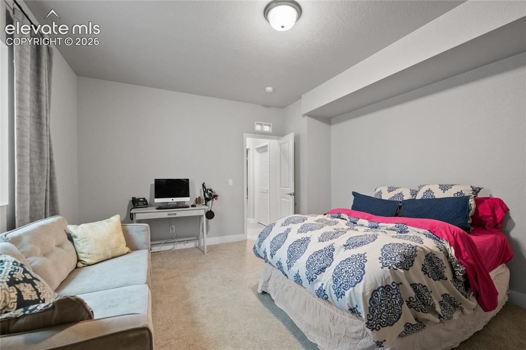 Image 37 of 45: Large basement bedroom 