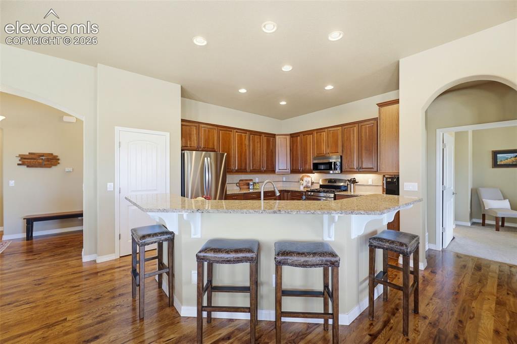 Image 12 of 48: The gourmet kitchen features convenient countertop seating!
