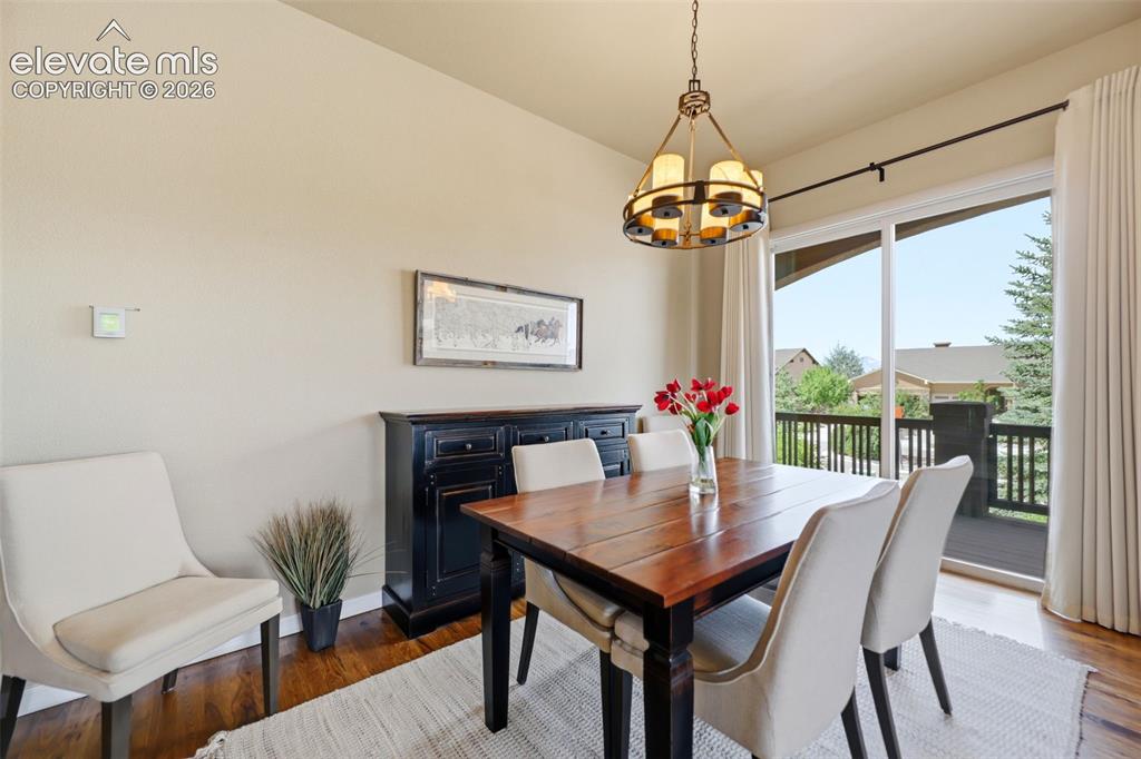 Image 14 of 48: The dining area has a walk-out to the covered deck!