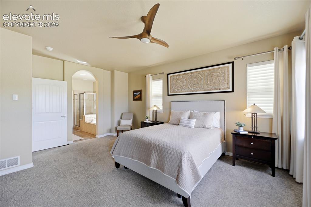 Image 19 of 48: Primary retreat is spacious and beautiiful!