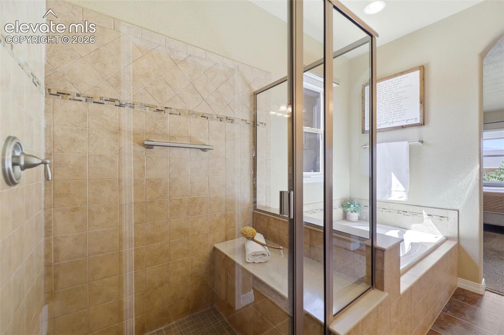Image 21 of 48: Spa shower with bench