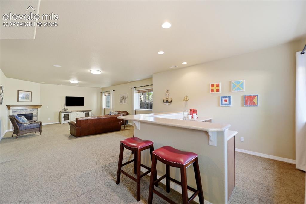 Image 31 of 48: Wet bar and family room