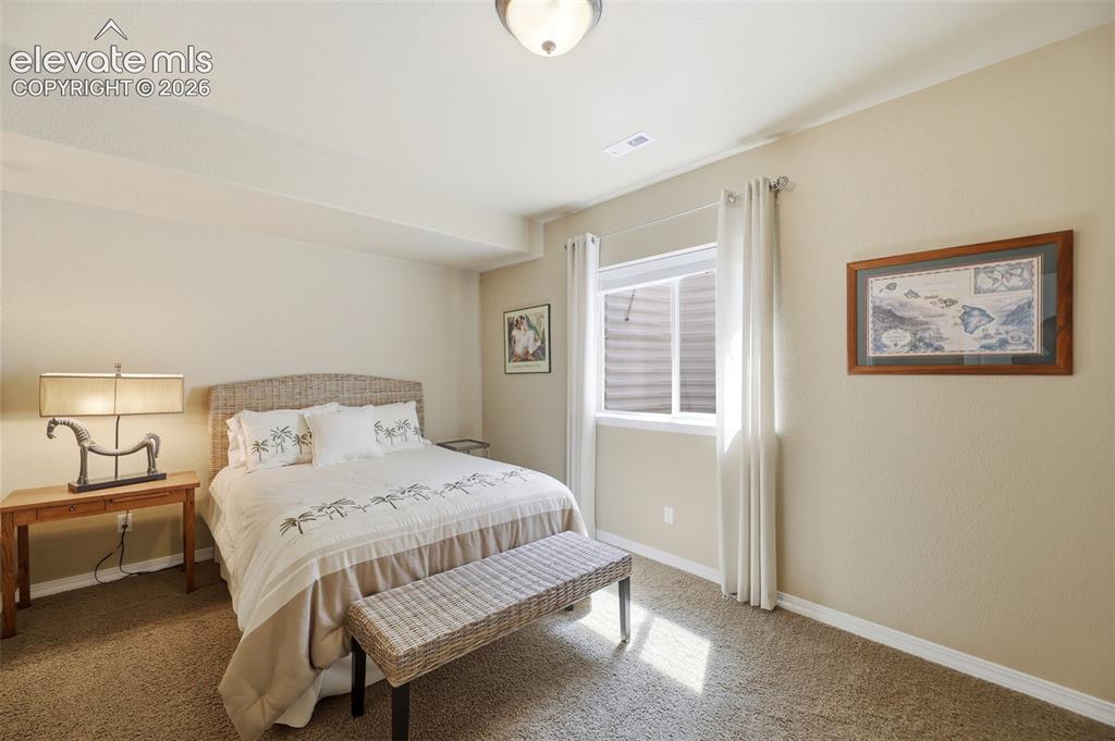 Image 34 of 48: A third bedroom in the basement is great for extra guests!