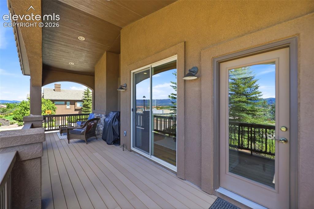 Image 37 of 48: The covered deck is perfect for entertaining guests!