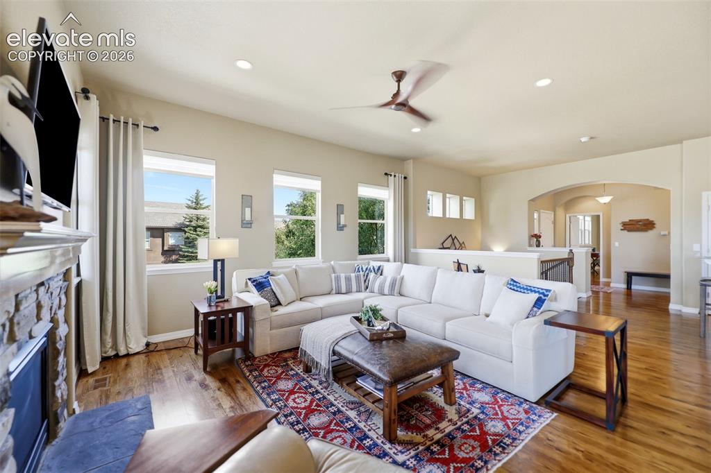Image 9 of 48: Gorgeous hickory flooring throughout the main level living space!