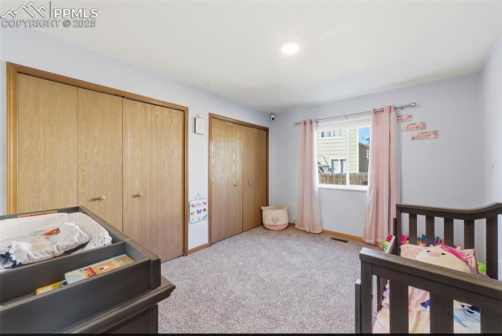 Image 16 of 32: Main Level Bedroom with double closets