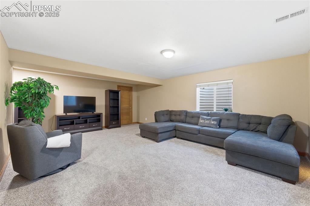 Image 19 of 32: Huge living area in basement