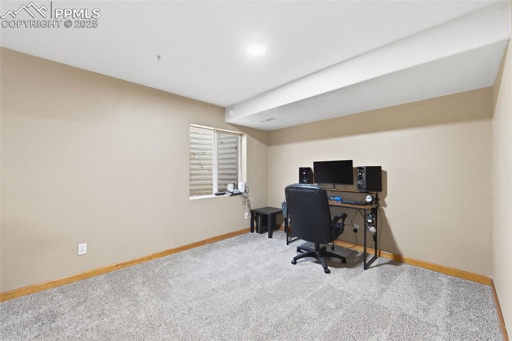 Image 22 of 32: Basement level bedroom