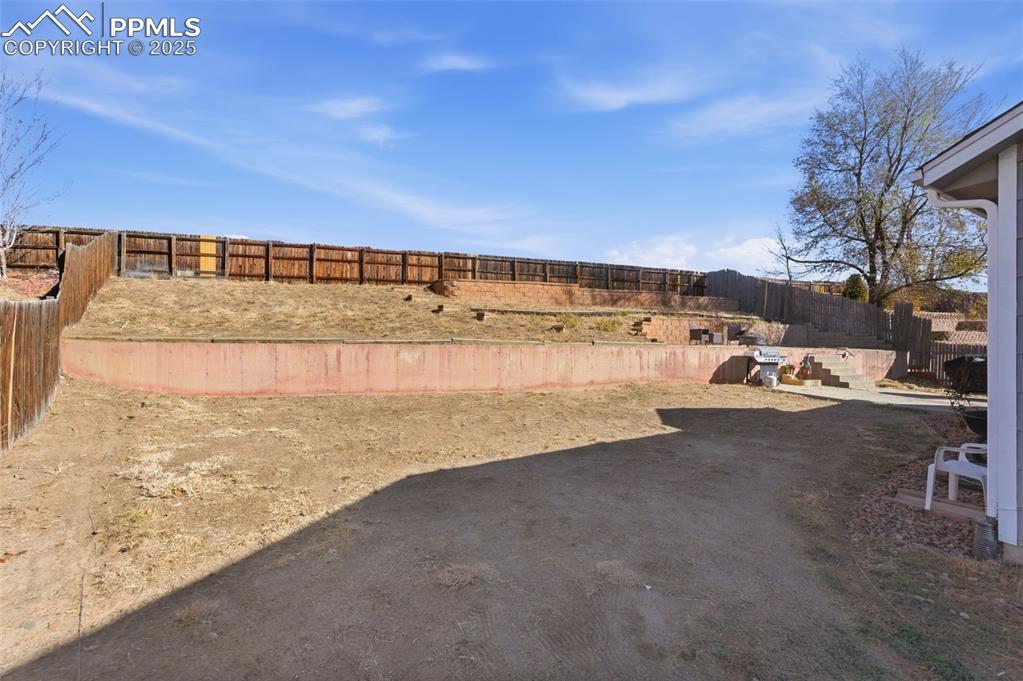 Image 29 of 32: So much potential for this huge back yard!