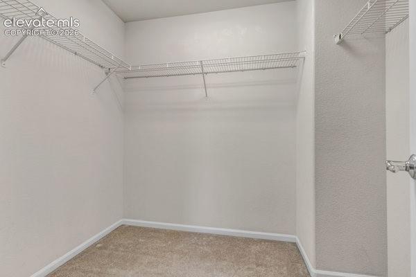 Image 23 of 35: Walk-in closet in the Primary