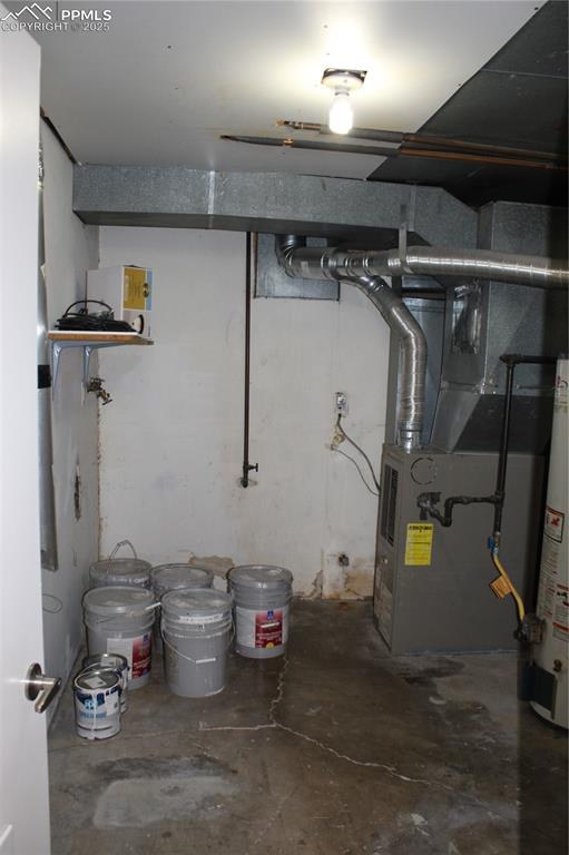 Image 11 of 19: 2012 Utility room, furnace, hot water heater and washer/dryer hookups