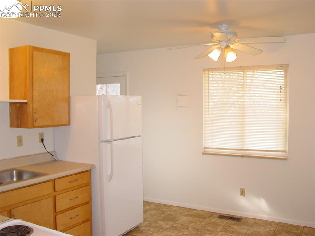 Image 14 of 19: 2014 Kitchen and backdoor