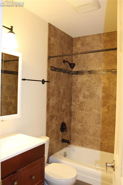 Image 7 of 19: 2012 Full bath with vanity and tub / shower combination with tile surround