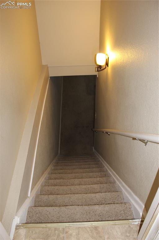 Image 9 of 19: 2012 Stairs to basement