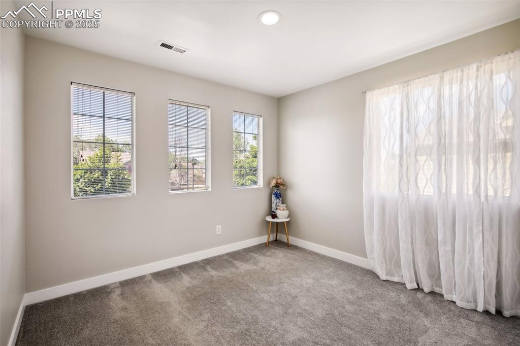 Image 19 of 28: Carpeted spare room featuring baseboards and recessed lighting
