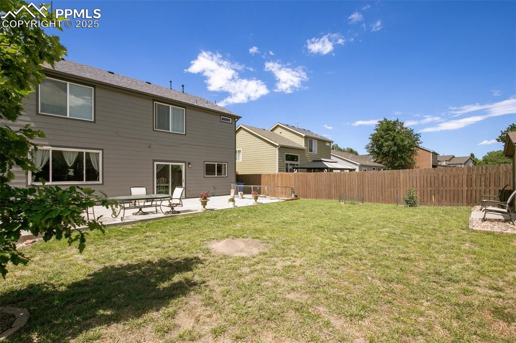 Image 25 of 28: Rear view of property featuring a patio area