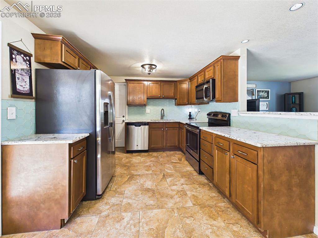Image 10 of 50: Spacious and functional layout with ample cabinetry, modern finishes, and a