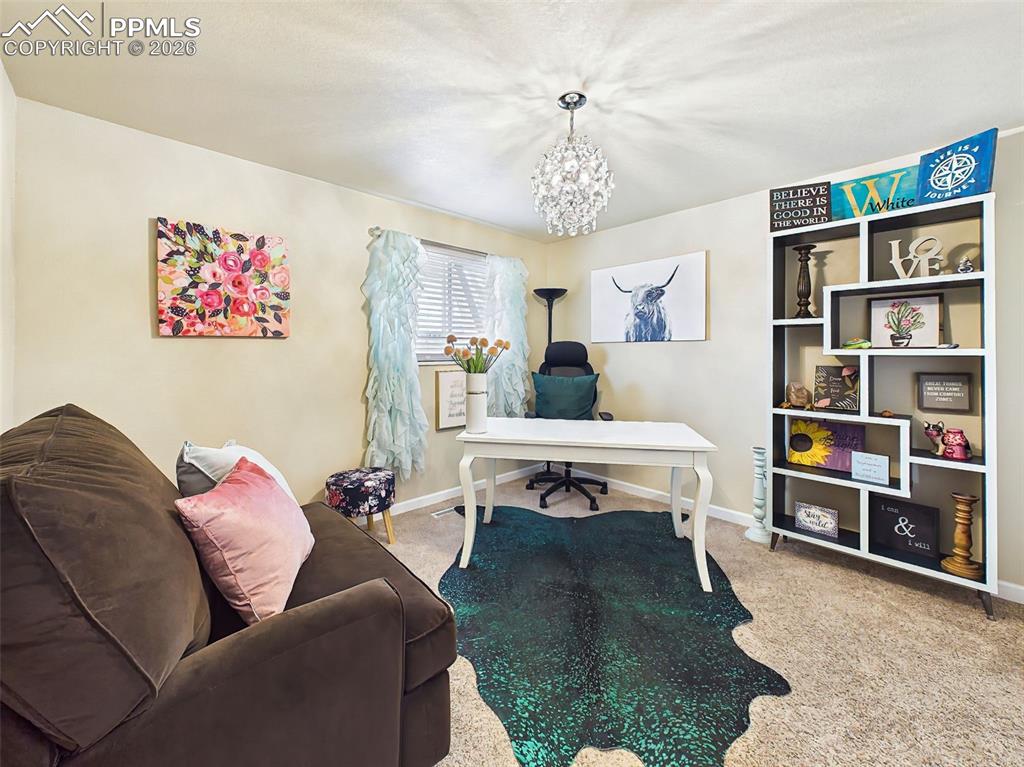 Image 28 of 50: Versatile space perfect for a home office or bedroom with a large window, o