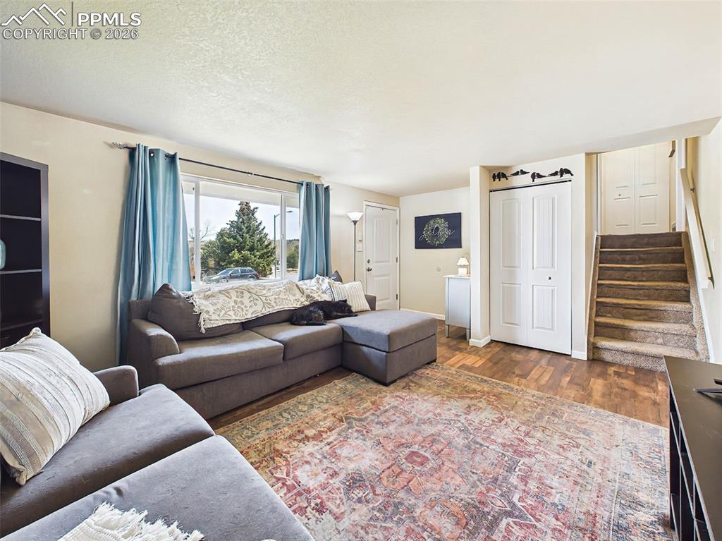 Image 8 of 50: Bright and open living space featuring a large window with natural light, n