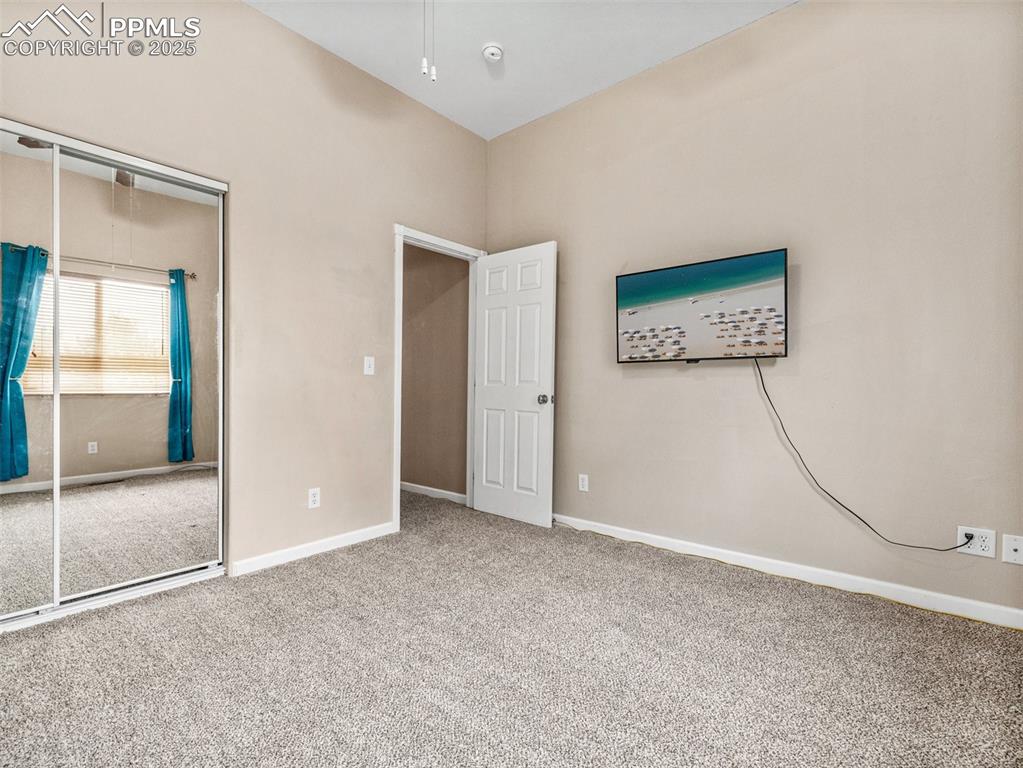 Image 14 of 46: Unfurnished bedroom featuring carpet flooring and a closet