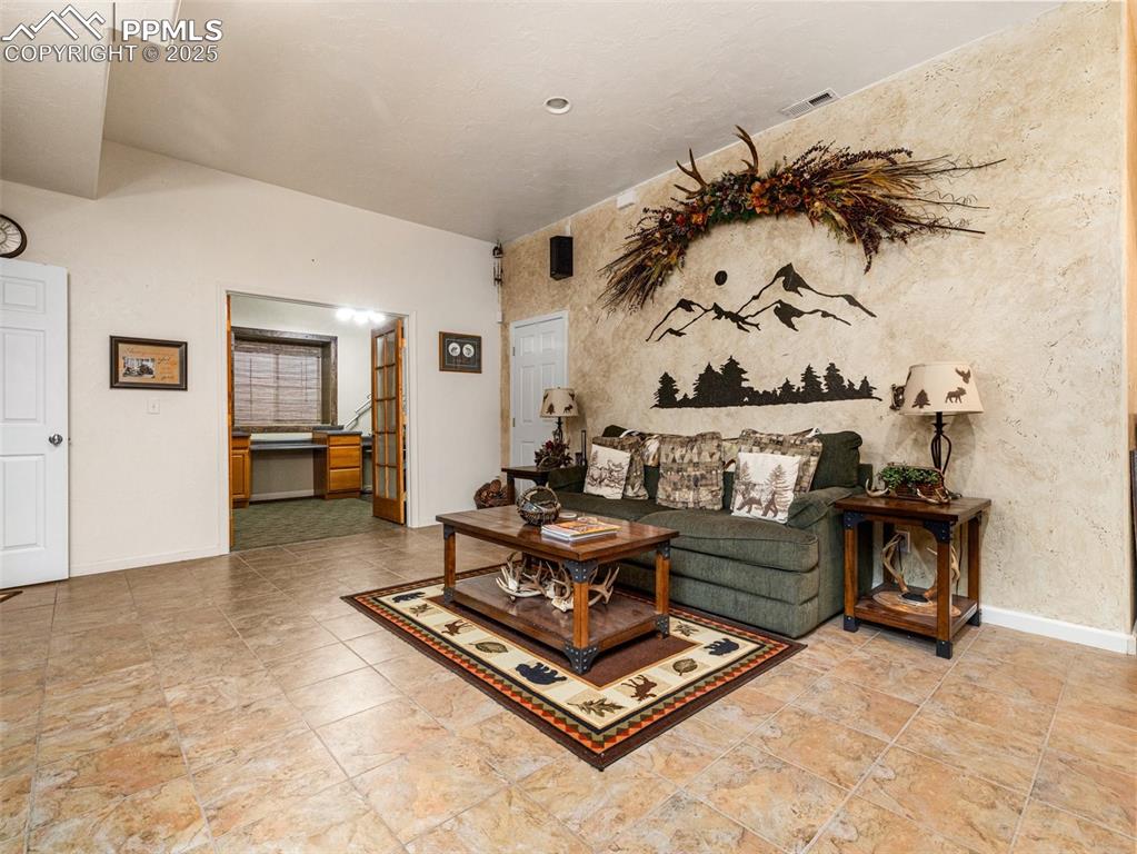 Image 23 of 46: Living area with baseboards