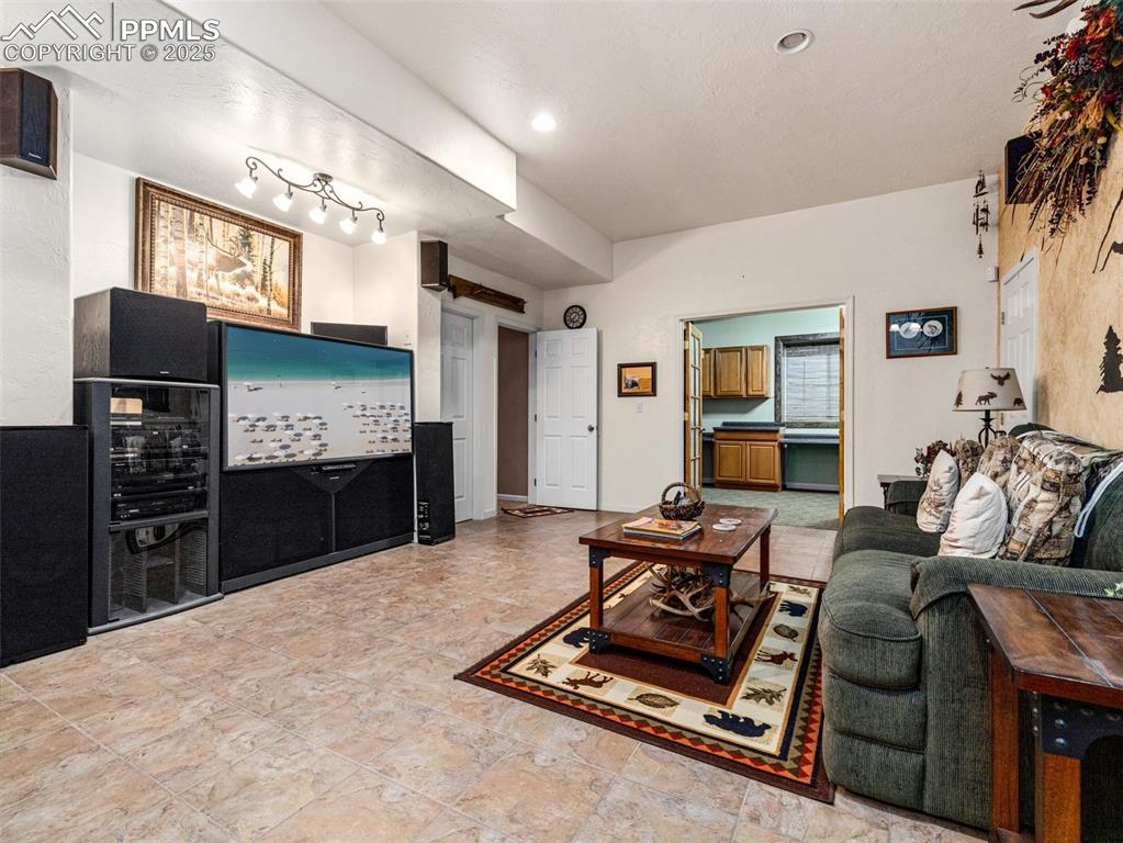 Image 24 of 46: Living area with recessed lighting