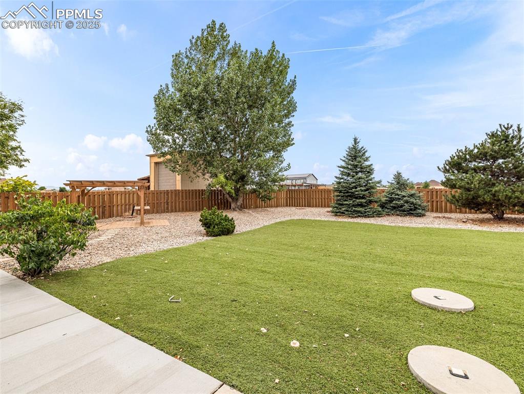Image 35 of 46: View of fenced backyard