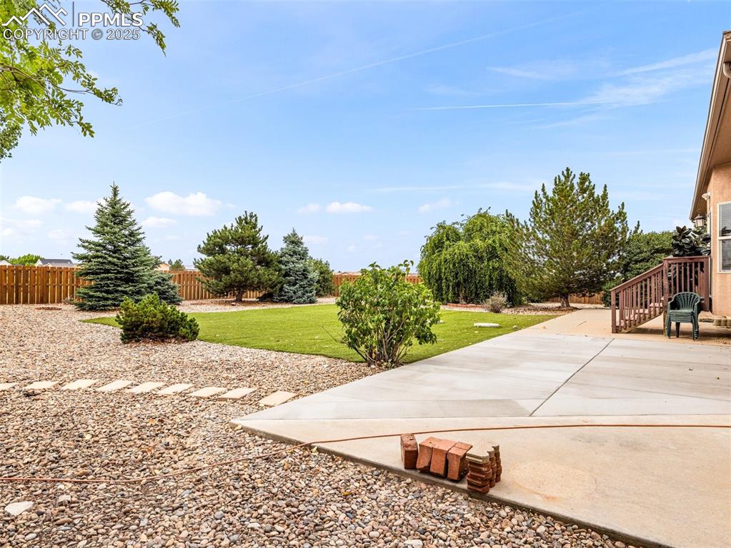 Image 38 of 46: View of yard with a patio area